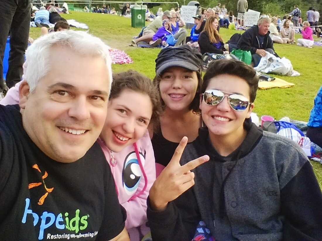 Greg Green and his children in 2014 at an event sponsored by HopeKids, which fosters community for children with serious illnesses and their families.