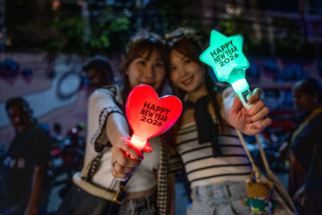  People buy batons that read happy New Year 2026 