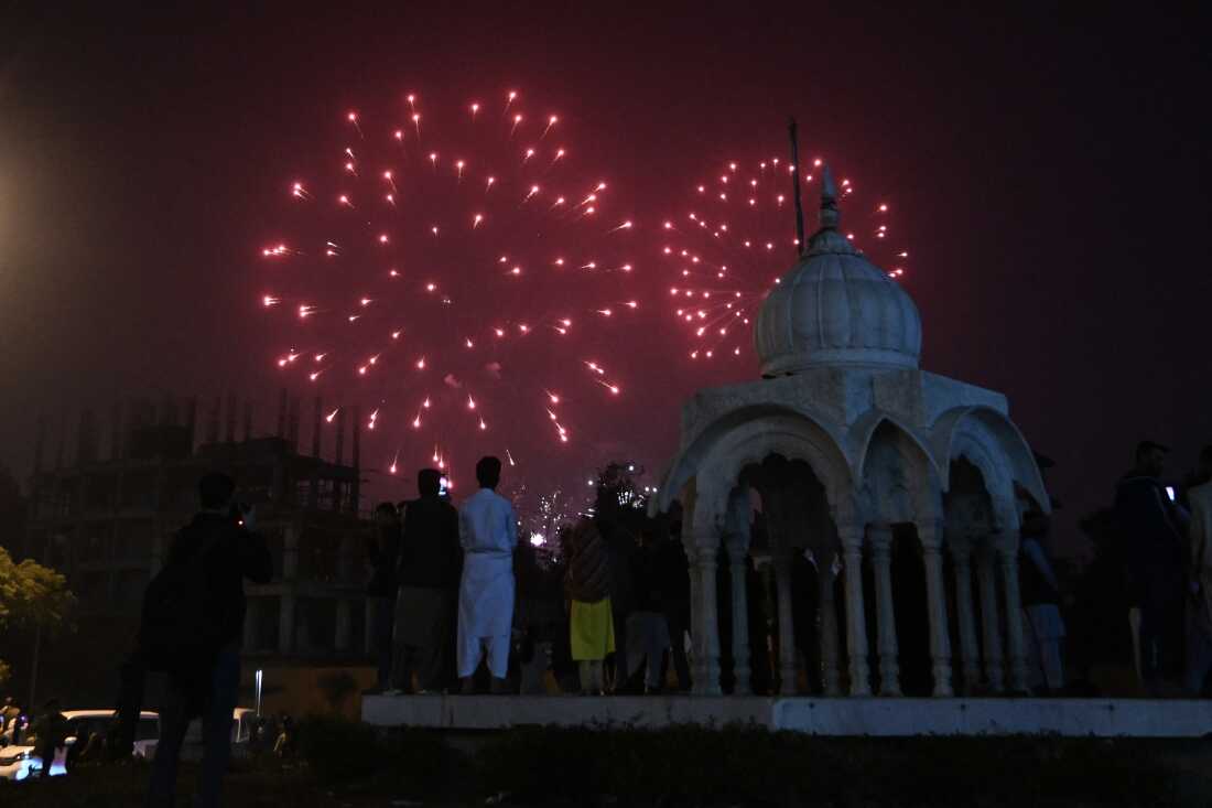 Revellers watch fireworks during the New Year celebrations in Karachi 