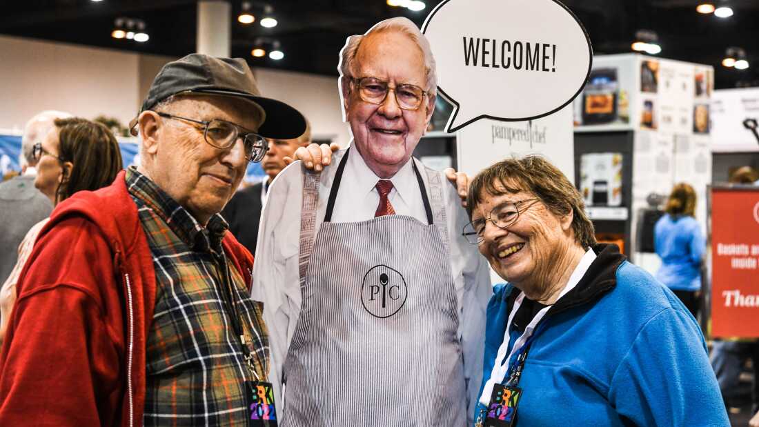Shareholders pose with a lifesize cardboard cutout of Warren Buffett in 2022, during Berkshire Hathaway's annual shareholders meeting in Omaha, Nebraska.