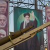 A domestically-built missile and banners showing portraits of the Iranian Supreme Leader Ayatollah Ali Khamenei, center, and armed forces commanders who were killed in an Israeli strike in June, are displayed in Baharestan Square, Tehran, Thursday, Sept. 25, 2025.