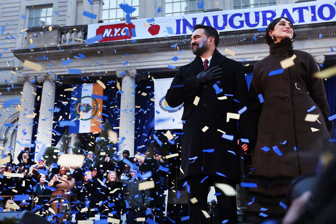 New York Mayor Zohran Mamdani stands on stage with his wife, Rama Duwaji, after he was ceremonially sworn in as New York City’s 112th mayor at City Hall on Thursday.