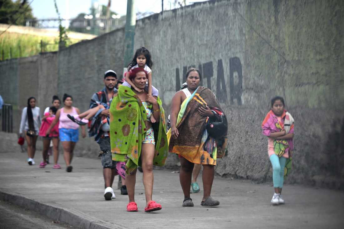 Civilians living inside Fuerte Tiuna, Venezuela's largest military complex, leave the place, in Caracas after U.S. forces captured Venezuelan leader  Nicolás Maduro after launching a "large scale strike" on the South American country.  