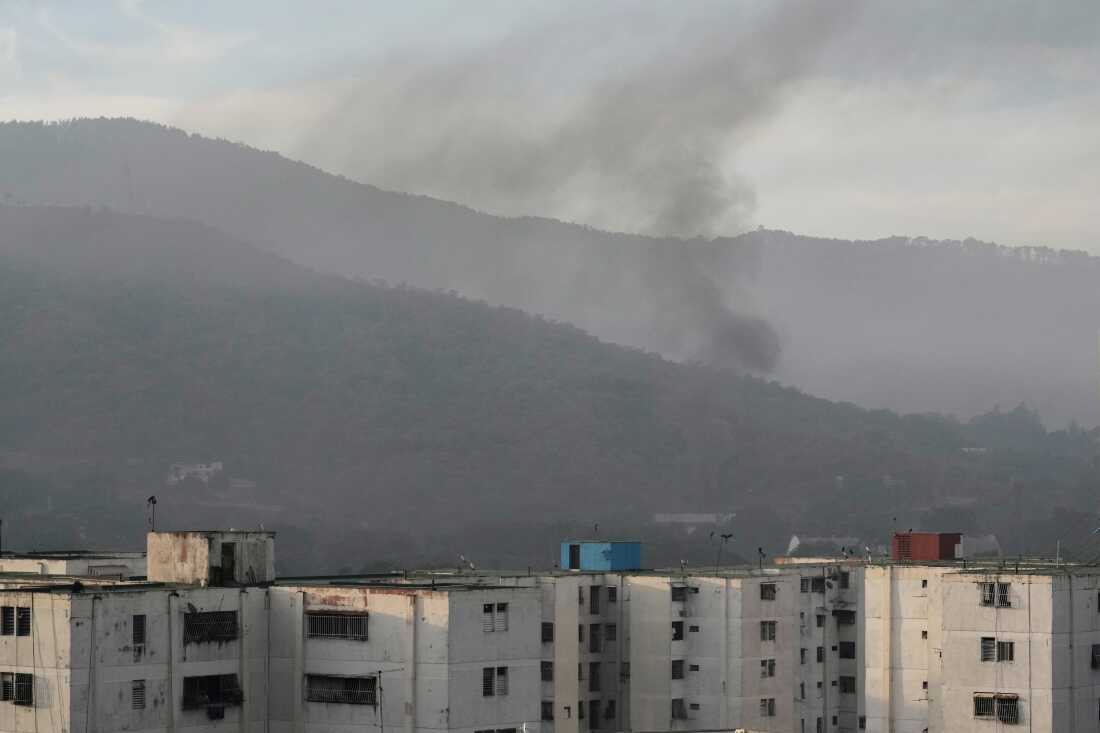 Smoke rises from Fort Tiuna, the main military garrison in Caracas, Venezuela, after multiple explosions were heard and aircraft swept through the area, Saturday, Jan. 3, 2026.