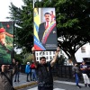 Supporters of Venezuela's current and former president, Nicolas Maduro and the late Hugo Chavez, hold posters with their images in Caracas on Saturday.