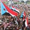 Supporters of the Southern Transitional Council (STC), a coalition of separatist groups seeking to restore the state of South Yemen, hold South Yemen flags during a rally, in Aden, Yemen, Friday.