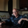 Scott Adams sit in an office next to Dilbert works in 2014. 
