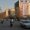Vehicles in Tehran drive past banners hanging from buildings with anti-U.S. and anti-Israel messages and portraits of Iranian armed forces commanders and nuclear scientists who were killed in Israeli strikes.