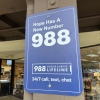 Sign for the 988 Lifeline mental health emergency hotline, Walnut Creek, California, December 20, 2024. The Trump administration has laid off more than 100 employees at the agency responsible for overseeing the number.