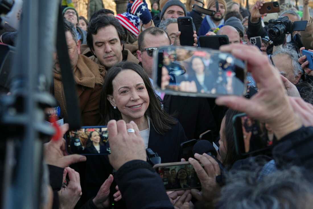 Venezuelan opposition leader María Corina Machado, center, leaves the Capitol, Thursday, Jan. 15, 2026, in Washington.