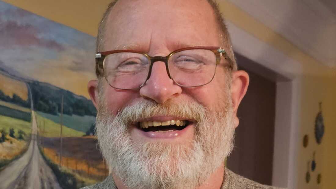 Tom Sinclair today, smiling while he holds a large cauliflower.