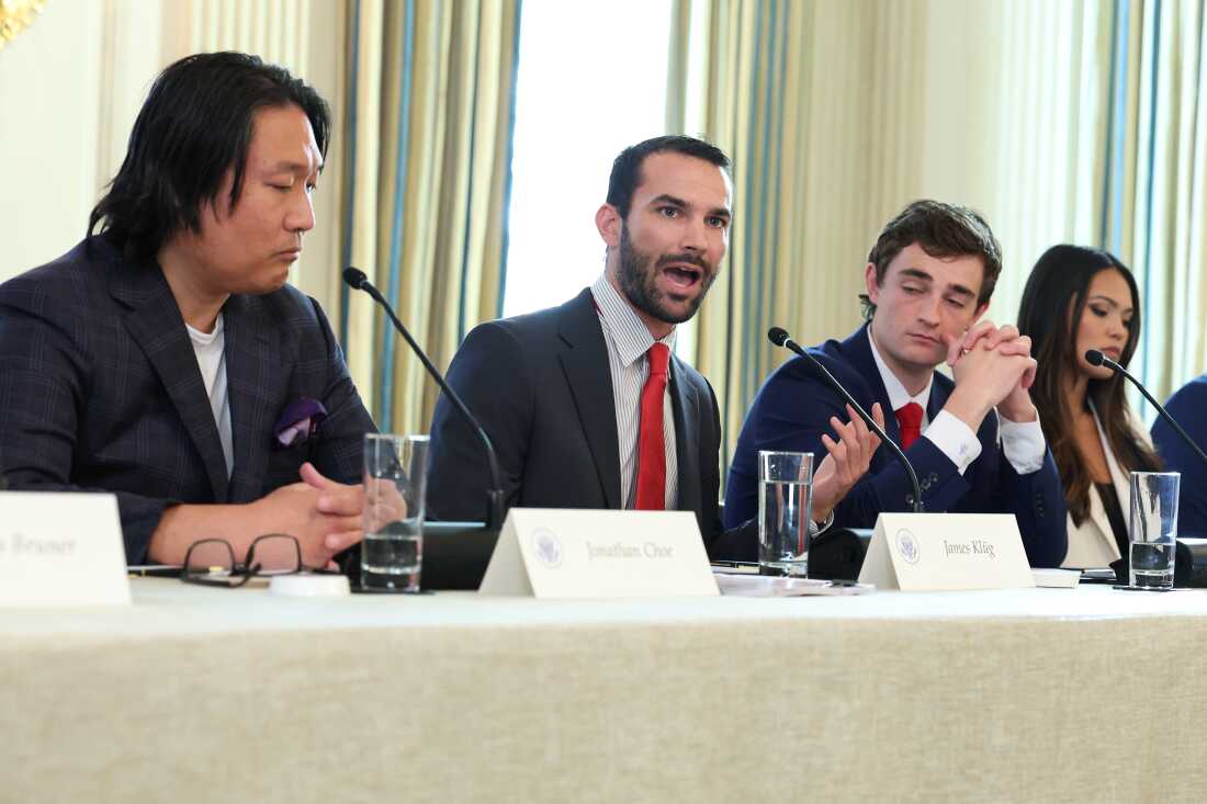 Pro-Trump social media influencer James Klug, center, speaks during a roundtable discussion at the White House in October 2025.