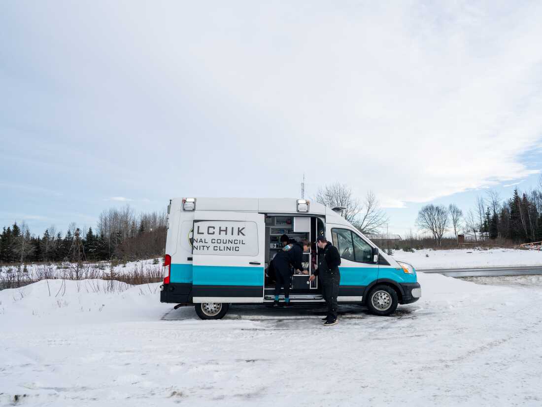 Dr. Sarah Spencer, Peer Support Specialist Harold Sargeant, and Case Manager Annette Hubbard set up at a location in Nikiski, Alaska on November 20, 2025.