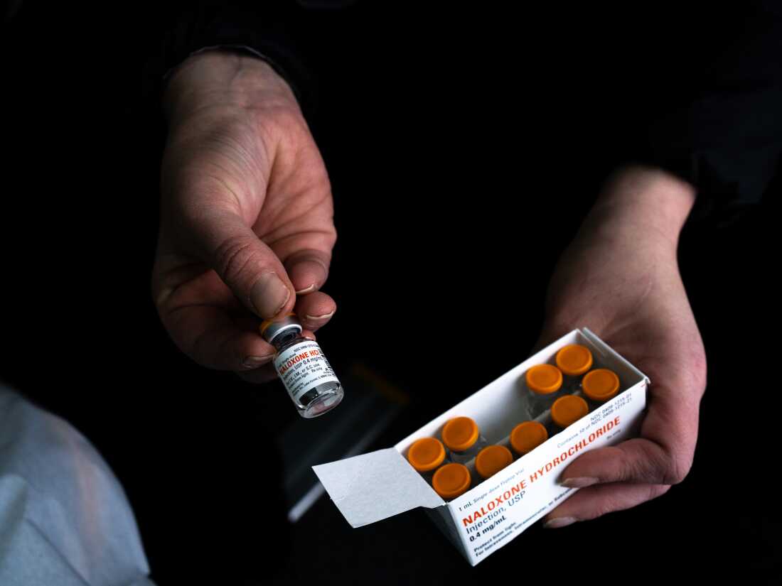 Case Manager Annette Hubbard holds a box of Naloxene injections that she says the clinic receives from the Remedy Alliance.