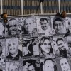 An art installation, which displays black and white images of people detained or deported as a result of ICE raids in Southern California, stands outside the federal building in Los Angeles, Thursday, July 17, 2025.