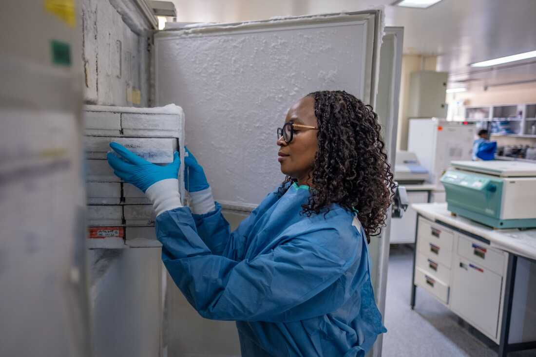 Scientist Nono Mkhize examines samples stored in a -80 degree freezer at the National Health Laboratory Service in Johannesburg, South Africa. Mkhize is part of a team of scientists working to develop a new vaccine for HIV.