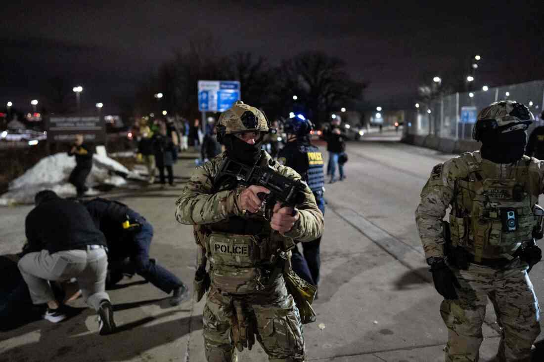 Federal immigration officers detain a protester outside Bishop Henry Whipple Federal Building, Jan. 15, 2026, in Minneapolis.