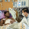 As his stem cells are collected, DeShawn “DJ” Chow talks about his upcoming sickle cell gene therapy treatment with pediatric hematologist-oncologist Leo Wang at City of Hope Children’s Cancer Center on May 22, 2024.
