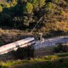Part of a wrecked train is photographed at the site of a train collision in Adamuz, southern Spain, on Monday.