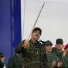 Nicolas Maduro brandishes a sword on Nov. 25, 2025, in Venezuela's capital Caracas, when he was still the country's president. U.S. forces seized Maduro on Jan. 3, part of President Trump's more aggressive foreign policy that has included multiple military operations in the past year.