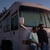 Ellaird Bailey and his wife, Charlotte, who lost their home in Altadena, California, to a wildfire in early 2025, stand in front of their recreational vehicle in December 2025.