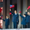 In this photo released by the Taiwan Presidential Office, Taiwanese President Lai Ching-te (center) is accompanied by his Vice President Bi-Khim Hsiao (second right) and officials wave national flags as they attend a New Year flag raising ceremony at the Presidential Office, in Taipei, Taiwan, on Thursday, Jan. 1.