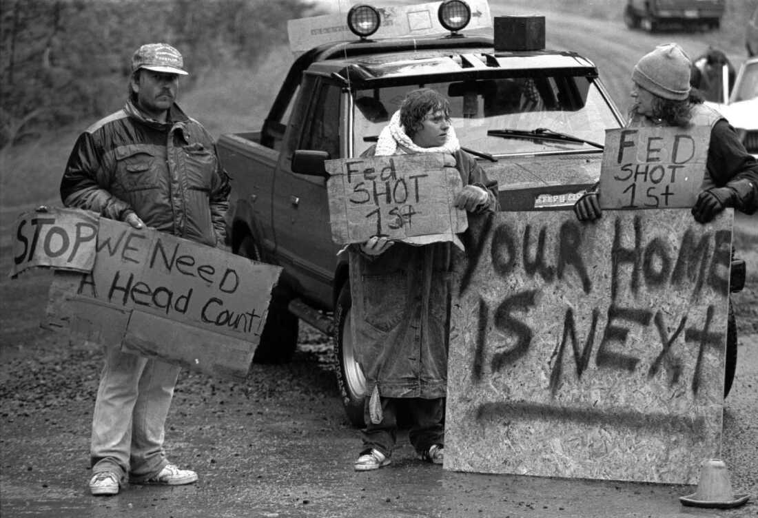 This Aug. 23, 1992, file photo shows Randy Weaver supporters at Ruby Ridge in northern Idaho. A 1992 standoff in the remote mountains of northern Idaho left a 14-year-old boy, his mother and a federal agent dead and sparked the expansion of radical right-wing groups across the country.