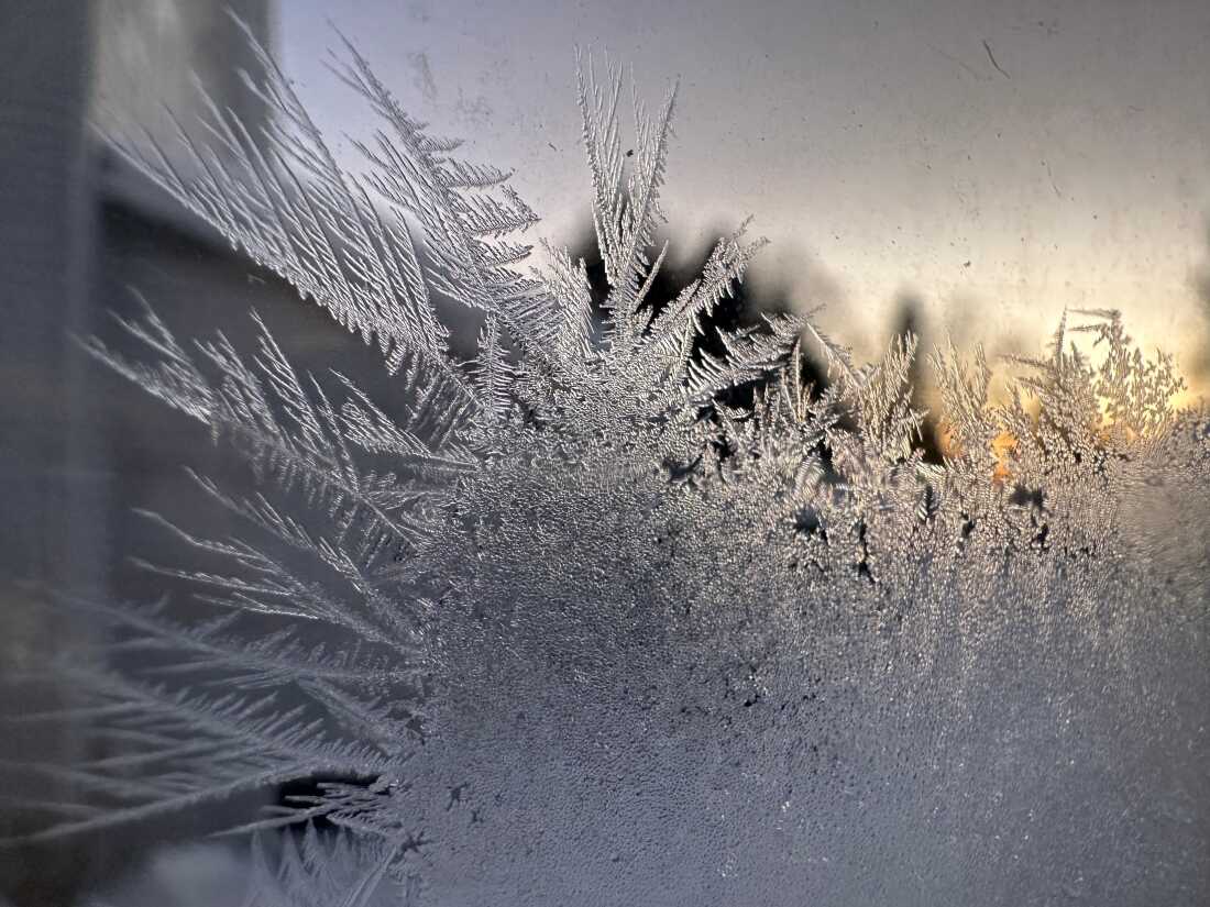 Ice crystals form inside a kitchen window in Lowville, New York