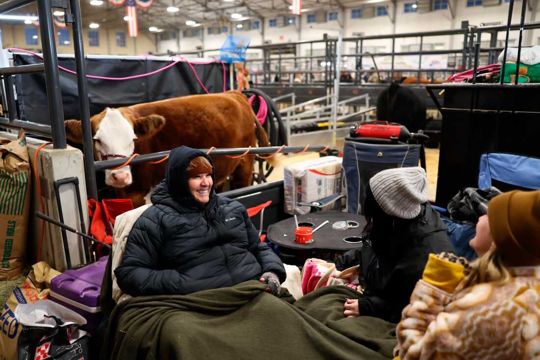 Workers are bundled up at the Fort Worth Stock Show & Rodeo ahead of an anticipated winter storm in Fort Worth, Texas.