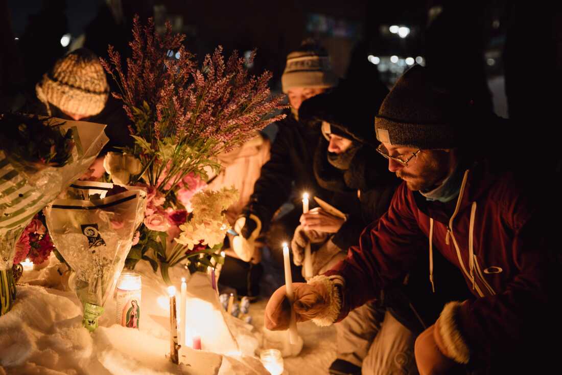 People gather during a vigil for 37-year-old Alex Pretti, who was fatally shot by a federal Border Patrol agent earlier in the day during an immigration enforcement operation in Minneapolis on Saturday, Jan. 24, 2026. Zaydee Sanchez for NPR