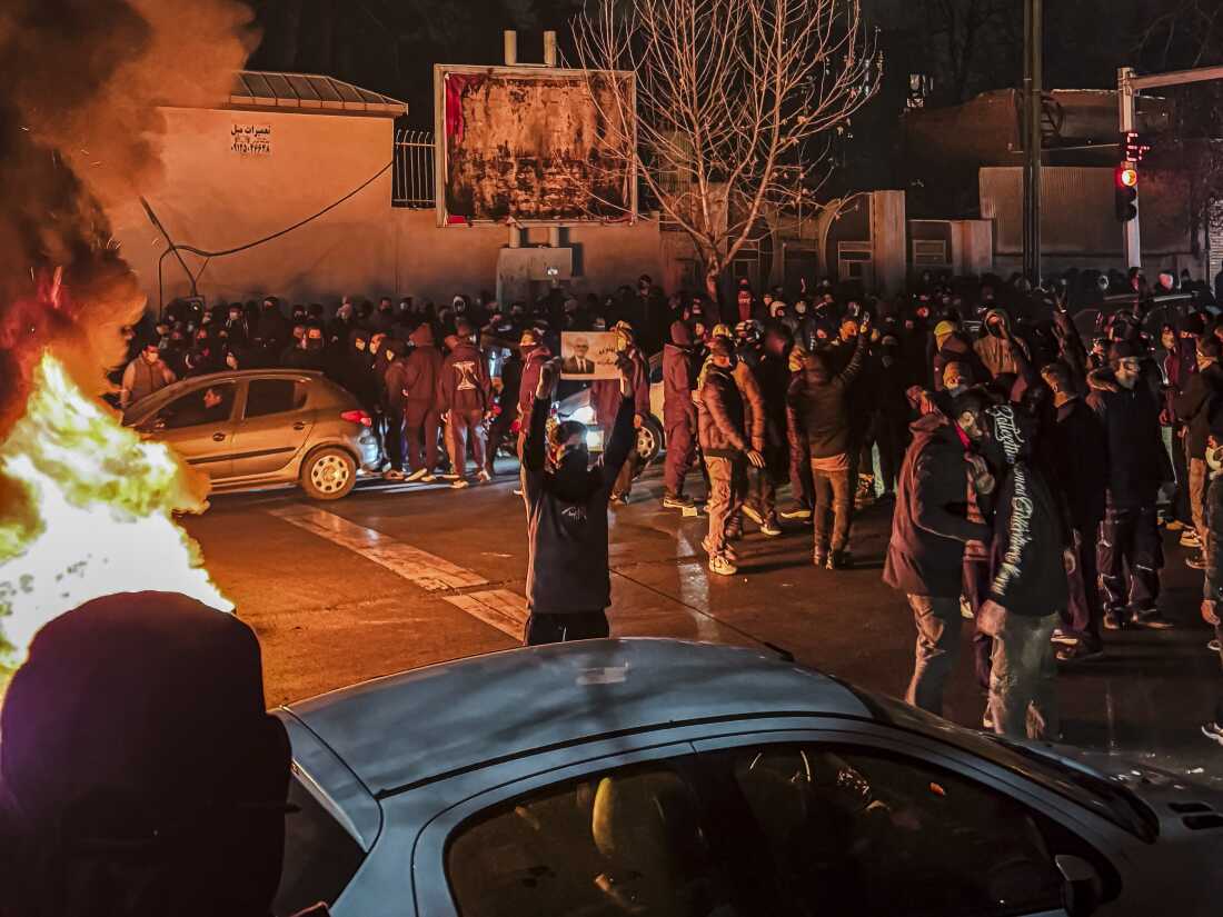 Iranians gather while blocking a street during a protest in Tehran, Iran on Jan. 9. The nationwide protests started in Tehran's Grand Bazaar against the failing economic policies in late December, which spread to universities and other cities, and included economic slogans, to political and anti-government ones.