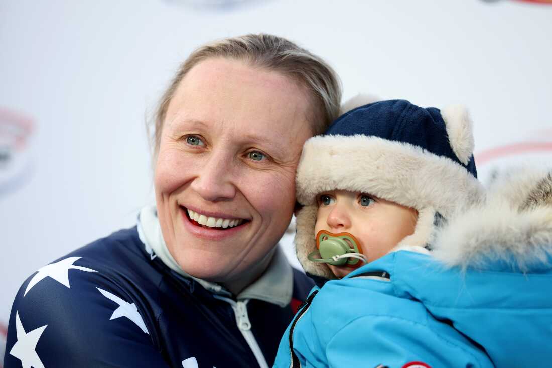 Kaillie Humphries holds her son, Aulden Armbruster, during the 2025 IBSF World Championships. She went through IVF treatments while competing.