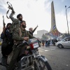 Syrian opposition fighters celebrate the fall of the Syrian government, in Damascus, Syria, 8, 2024. (AP Photo/Omar Sanadiki)