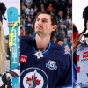 Side-by-side photos of Alpine skiier Lindsey Vonn, NHL player Connor Hellebuyck and halfpipe snowboarder Chloe Kim.