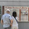 Tourists read a display titled "The Dirty Business of Slavery" at the President's House in Philadelphia on Aug. 9. Thirteen separate panels at the site are under review by the National Park Service for potential removal or editing. 