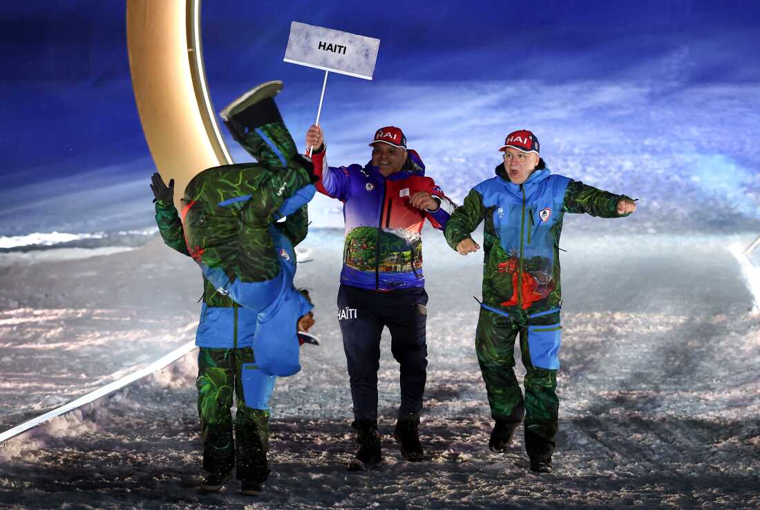 Athletes of Team Haiti arrive during the opening ceremony of the Milano Cortina 2026 Winter Olympic Games in Livigno. (Photo by / POOL / AFP via Getty Images)