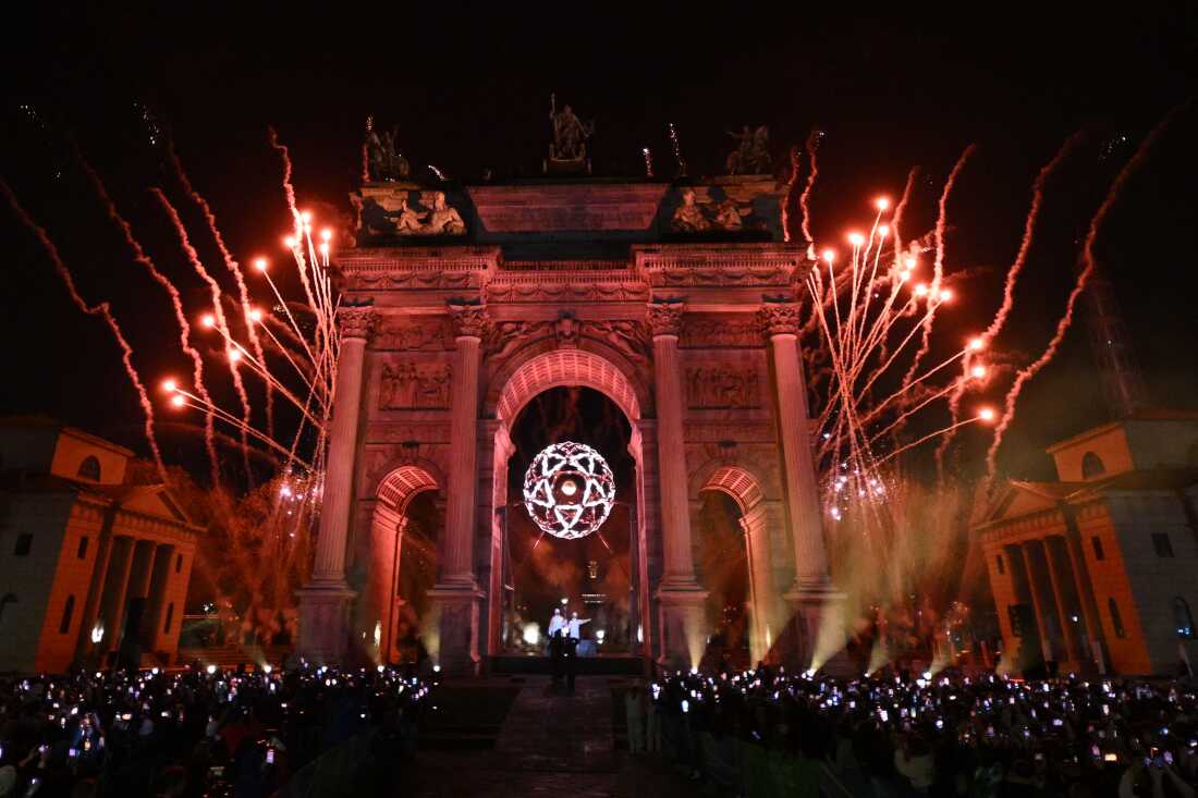 A general view of the Olympic flame in the Olympic cauldron designed by Marco Balich next to the Arco della Pace monument in Milan.